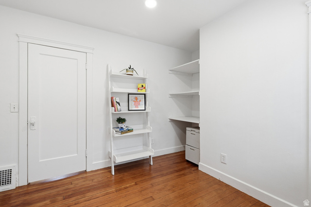 2864 Fowler Avenue Ogden, UT 84403 - Photo 14 of 26 Hardwood flooring complemented by white trim and neutral wall finishes