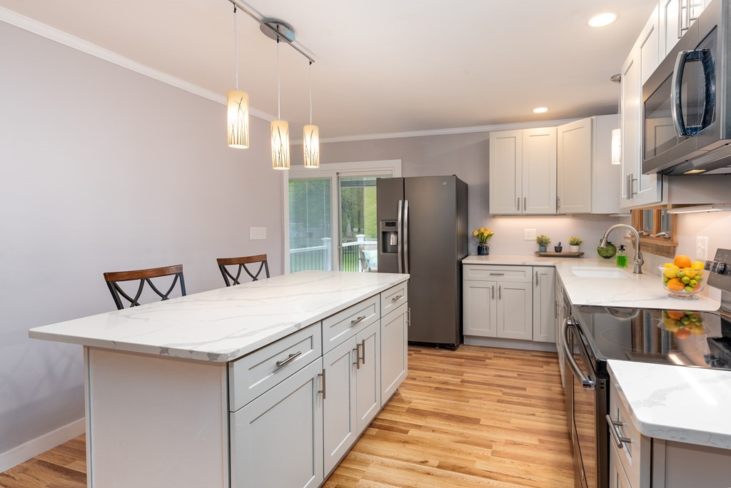 40 Riley Road Northborough, MA 01532 - Photo 11 of 24 a kitchen with white cabinets and stainless steel appliances
