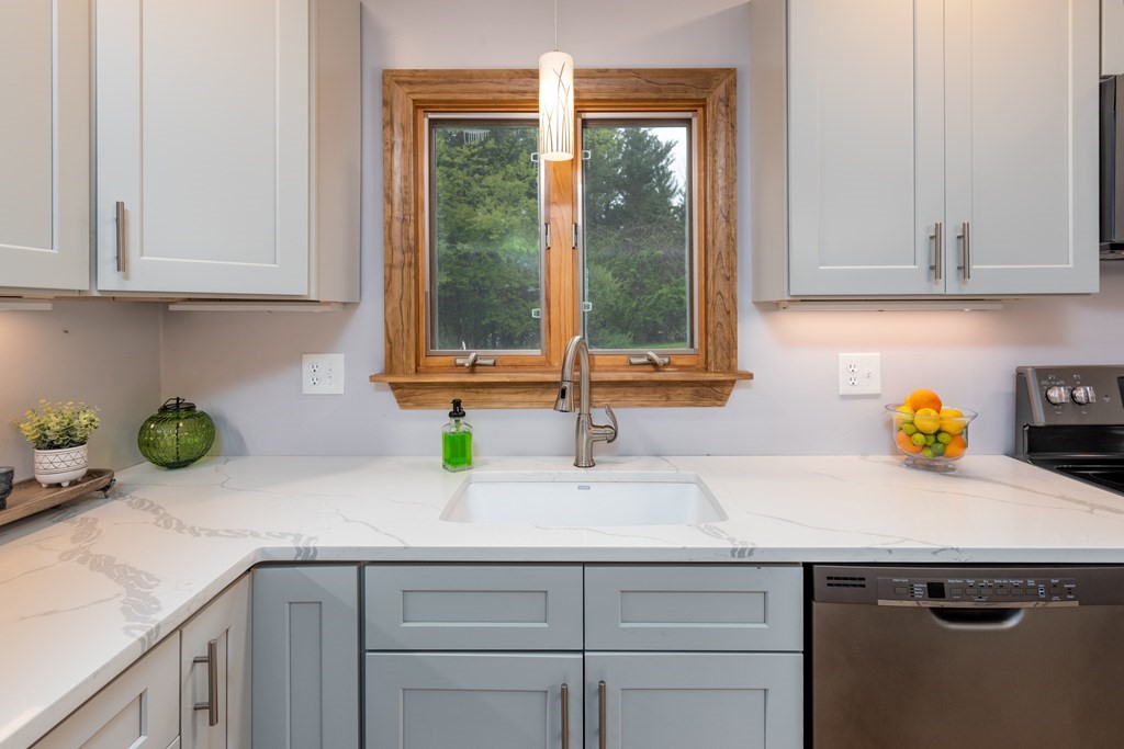 40 Riley Road Northborough, MA 01532 - Photo 12 of 24 a kitchen with stainless steel appliances granite countertop a sink a window and counter space