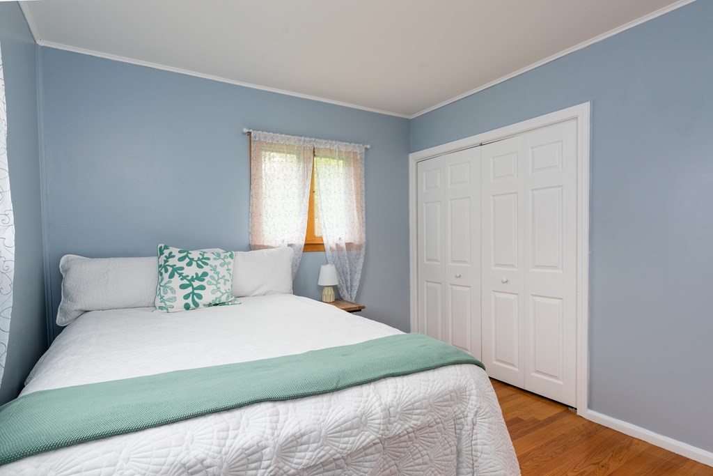 40 Riley Road Northborough, MA 01532 - Photo 14 of 24 a bedroom with a large bed and wooden floor