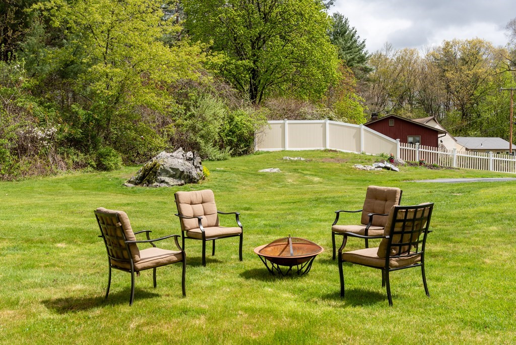 40 Riley Road Northborough, MA 01532 - Photo 20 of 24 a backyard of a house with table and chairs