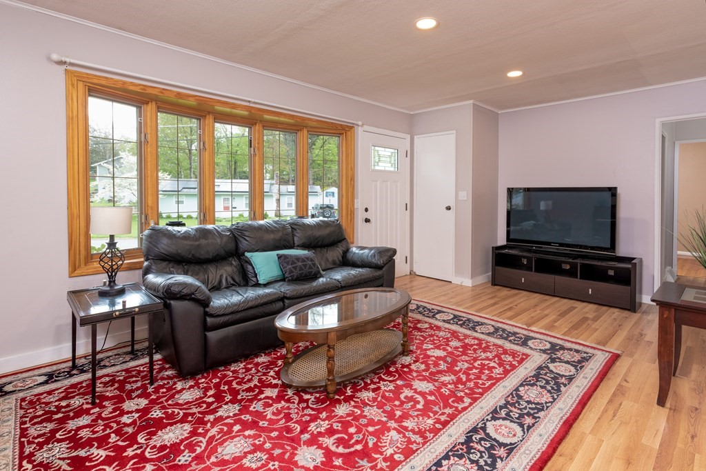 40 Riley Road Northborough, MA 01532 - Photo 6 of 24 a living room with furniture and a flat screen tv