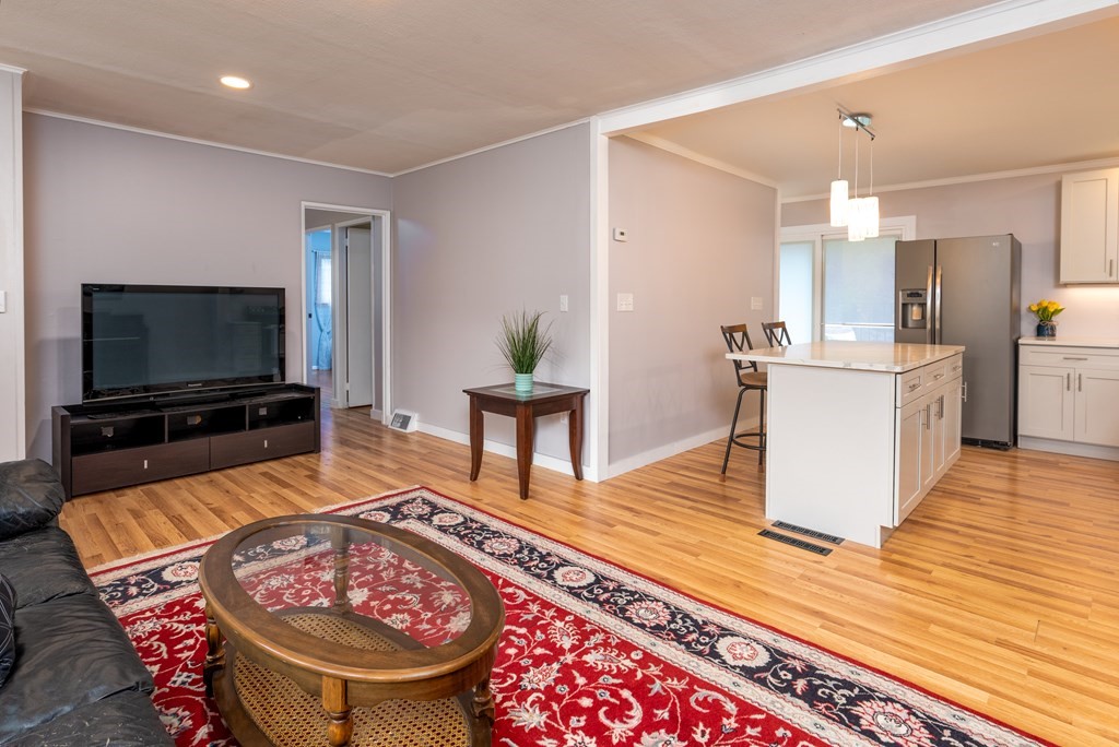 40 Riley Road Northborough, MA 01532 - Photo 8 of 24 a living room with stainless steel appliances furniture and a flat screen tv