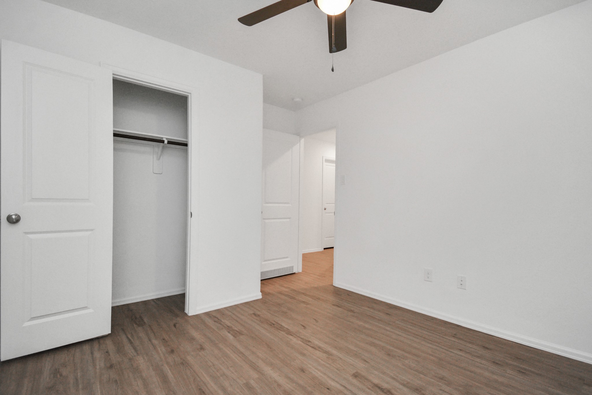 27023 Rimini Point Drive Katy, TX 77493 - Photo 14 of 15 a view of an empty room with wooden floor