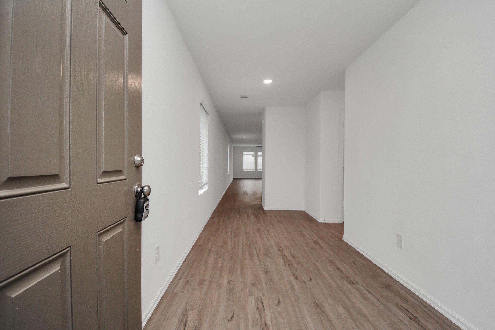 27023 Rimini Point Drive Katy, TX 77493 - Photo 3 of 15 a view of a hallway with wooden floor