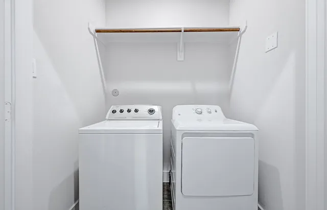 a utility room with dryer and washer