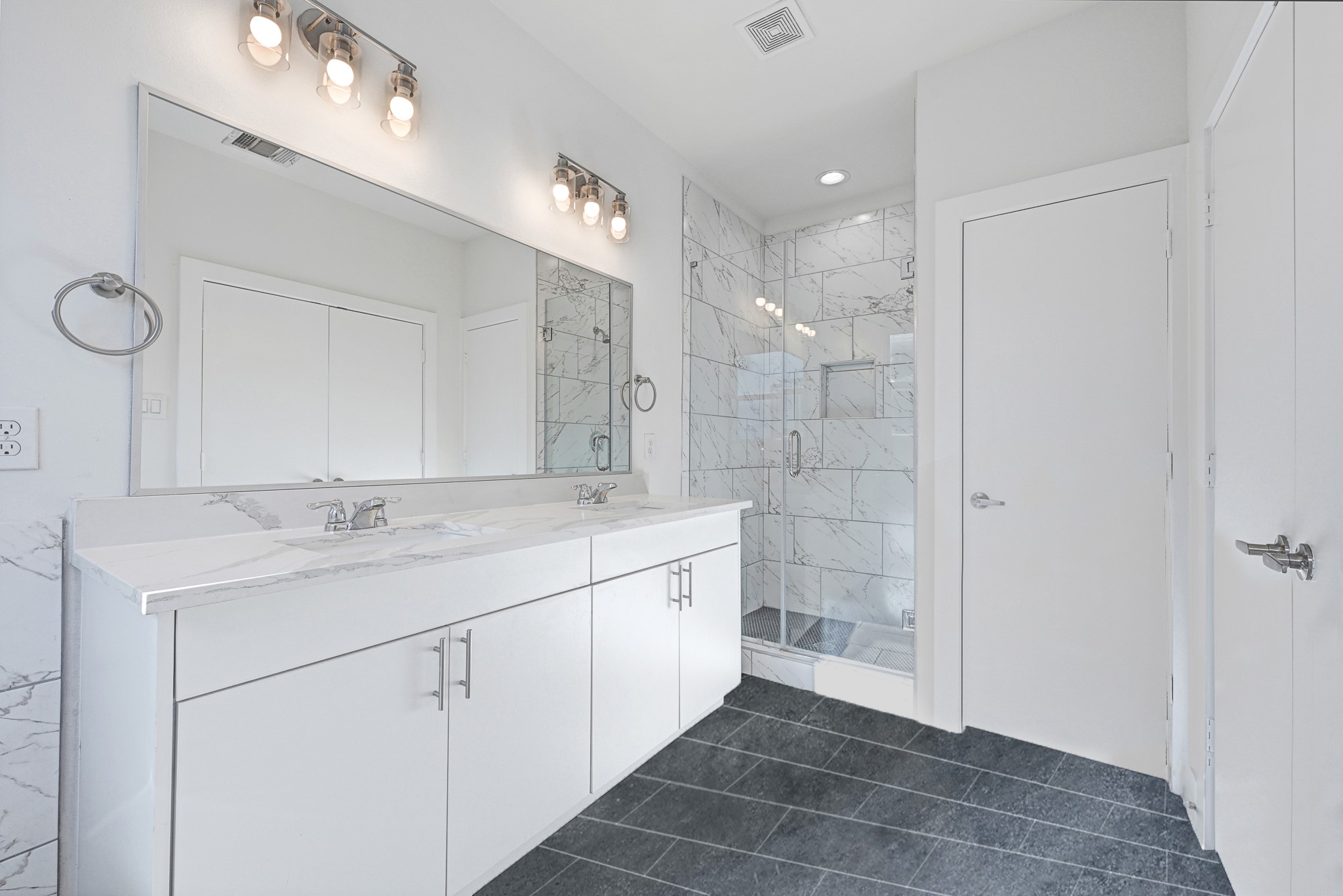 3313 Baer Street Houston, TX 77020 - Photo 26 of 26 a bathroom with a double vanity sink and a mirror