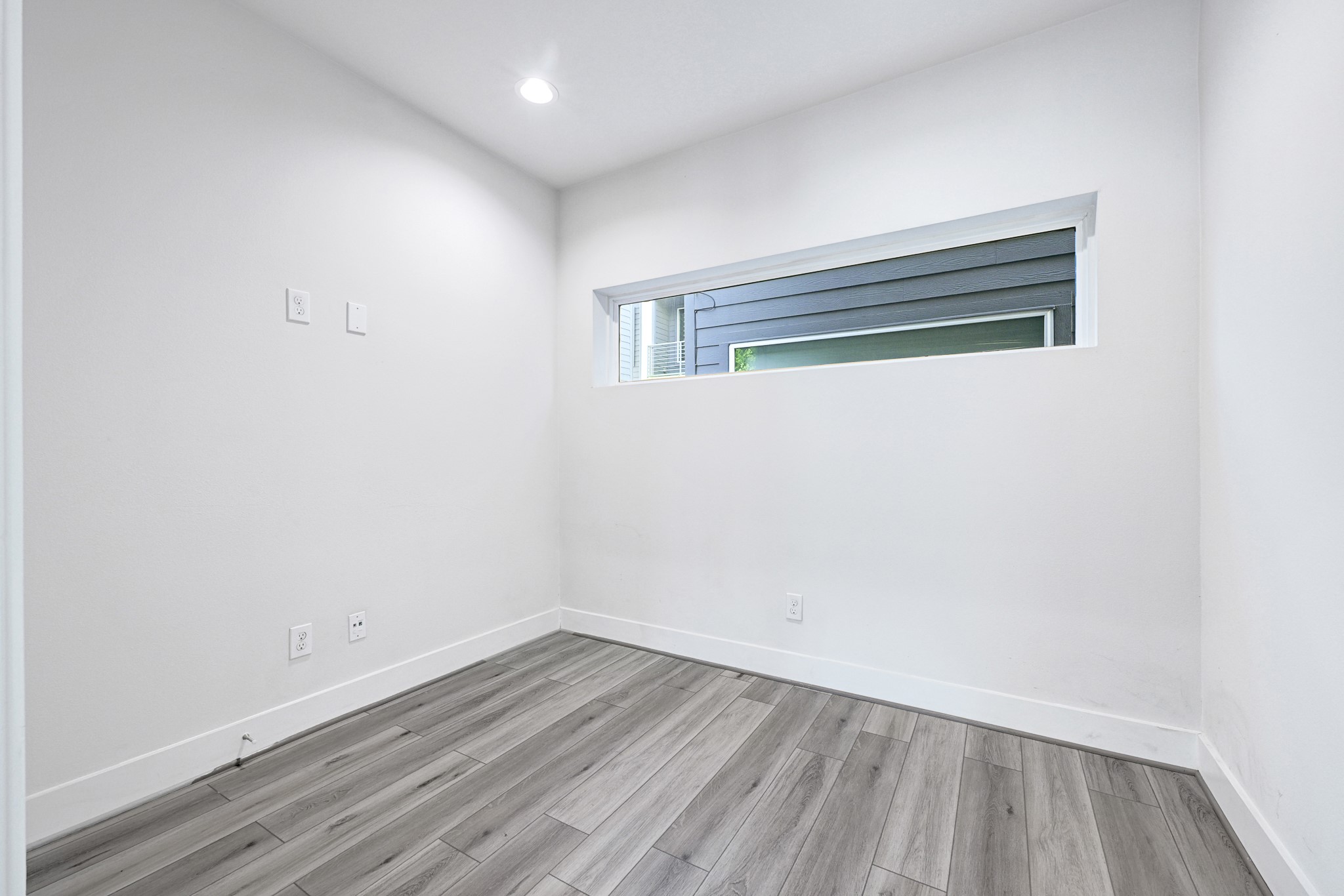 3313 Baer Street Houston, TX 77020 - Photo 7 of 26 a view of a room with wooden floor and window