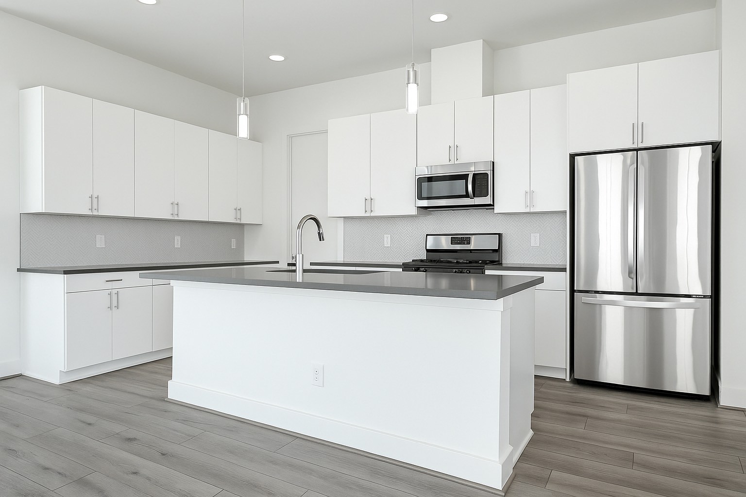 3313 Baer Street Houston, TX 77020 - Photo 10 of 26 a kitchen with a refrigerator a stove top oven and white cabinets