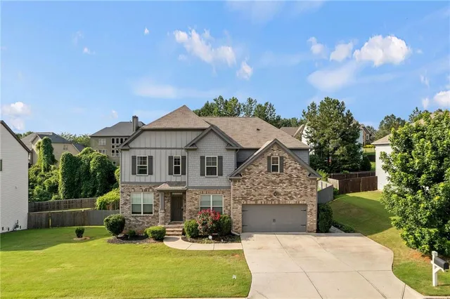 a view of a house with couches in front of house
