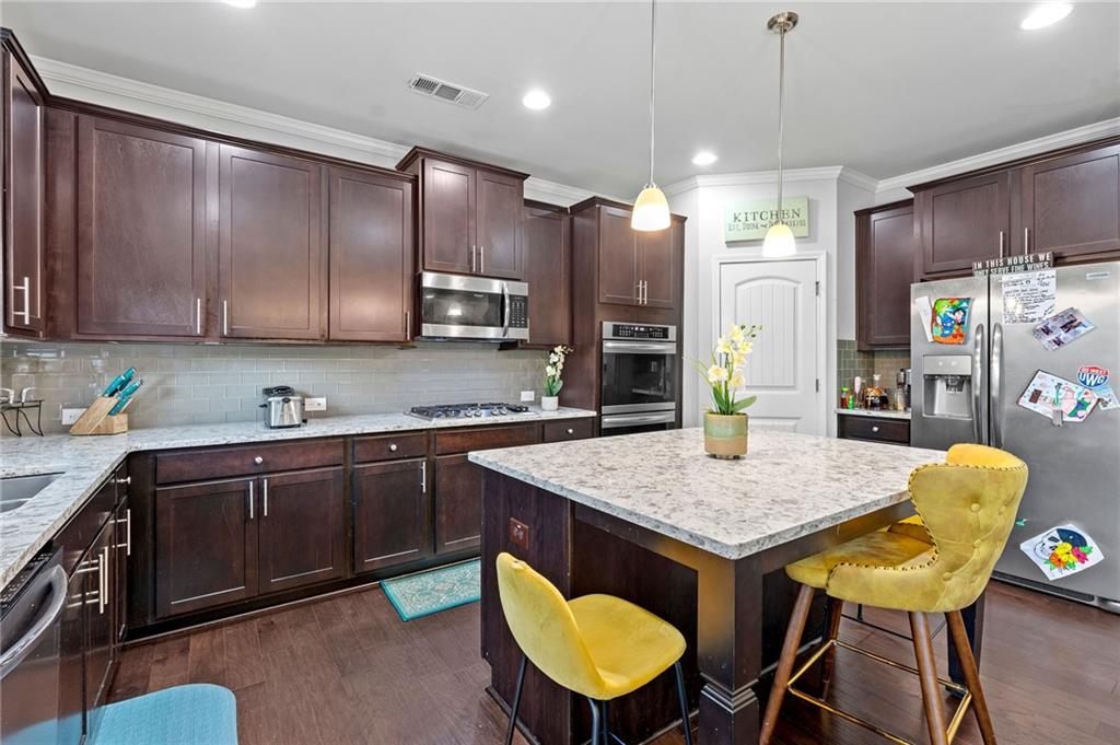 108 Fountain Oak Villa Rica, GA 30180 - Photo 14 of 45 a kitchen with a table chairs sink and cabinets