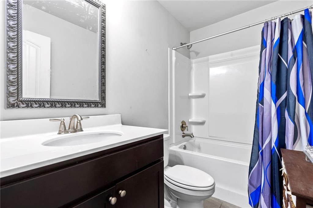 108 Fountain Oak Villa Rica, GA 30180 - Photo 22 of 45 a bathroom with a sink a toilet and a bathtub