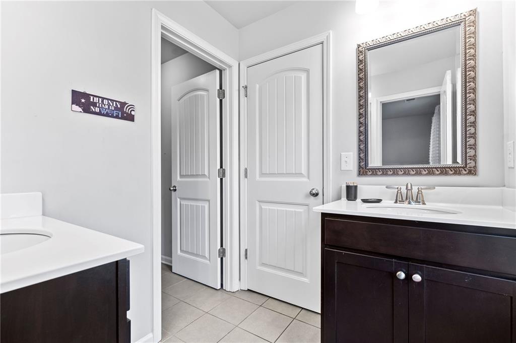 108 Fountain Oak Villa Rica, GA 30180 - Photo 23 of 45 a bathroom with a sink and a mirror