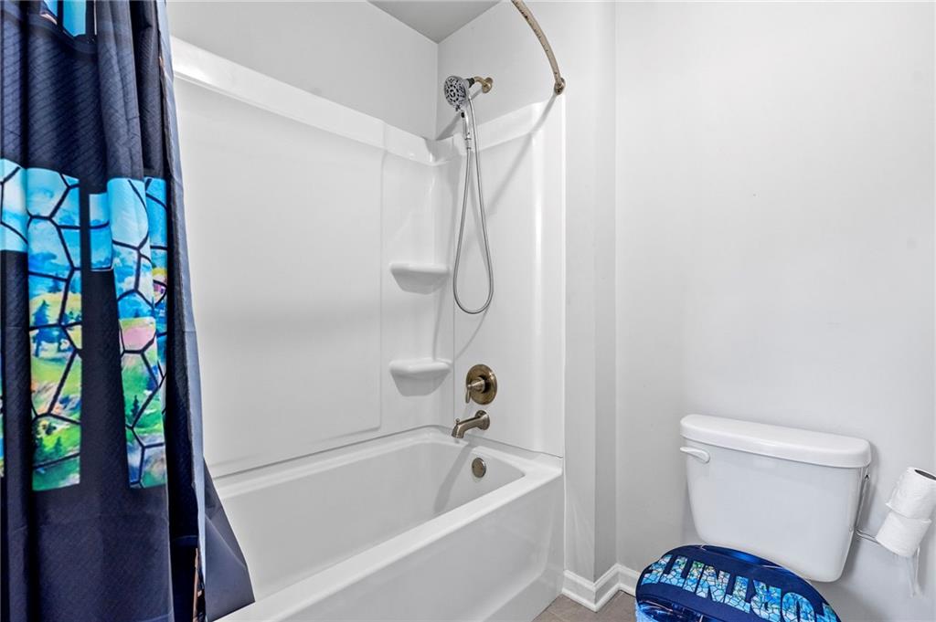 108 Fountain Oak Villa Rica, GA 30180 - Photo 24 of 45 a bathroom with a toilet and a shower