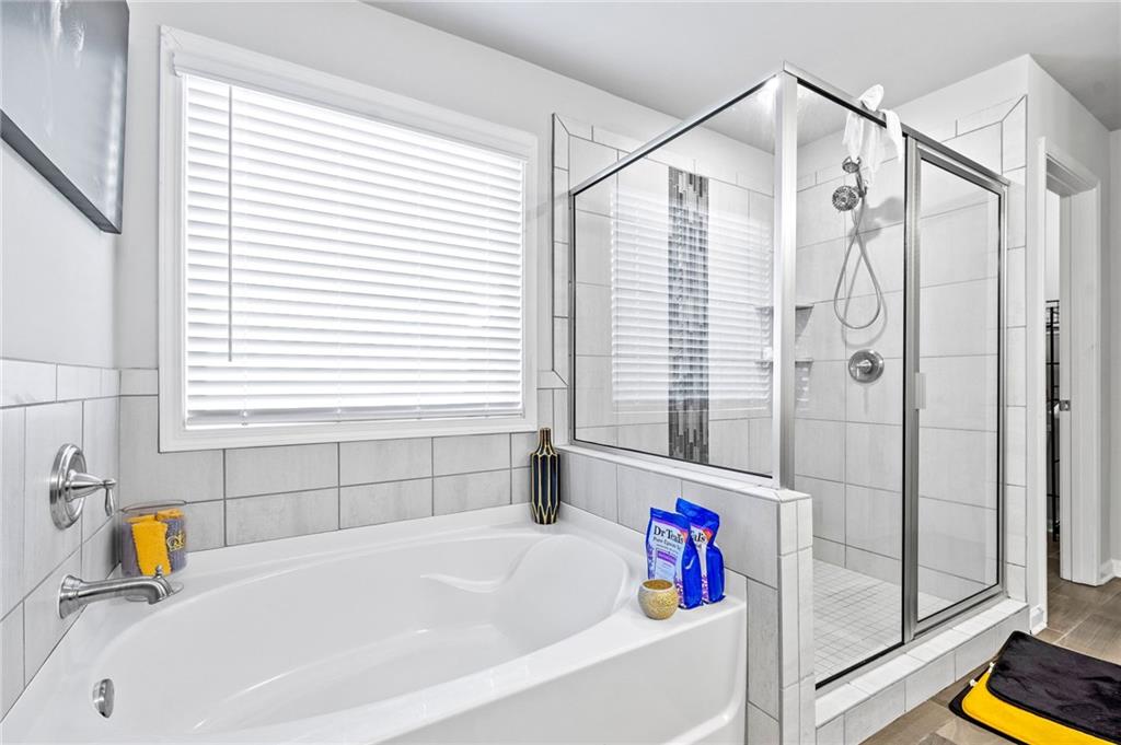108 Fountain Oak Villa Rica, GA 30180 - Photo 26 of 45 a bathroom with a bathtub and a shower