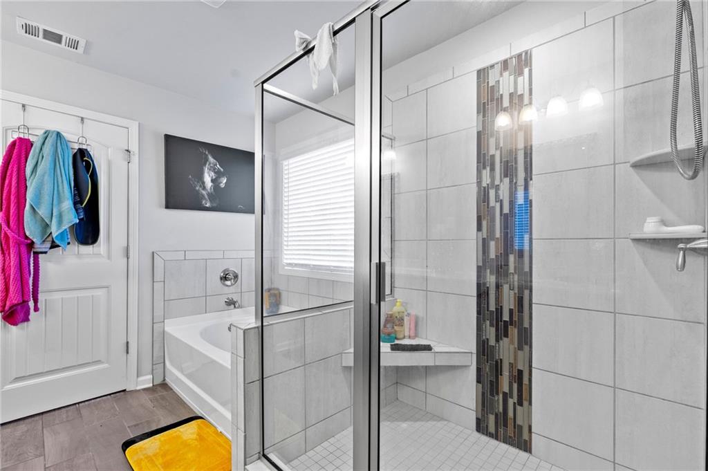 108 Fountain Oak Villa Rica, GA 30180 - Photo 28 of 45 a bathroom with a tub and a shower