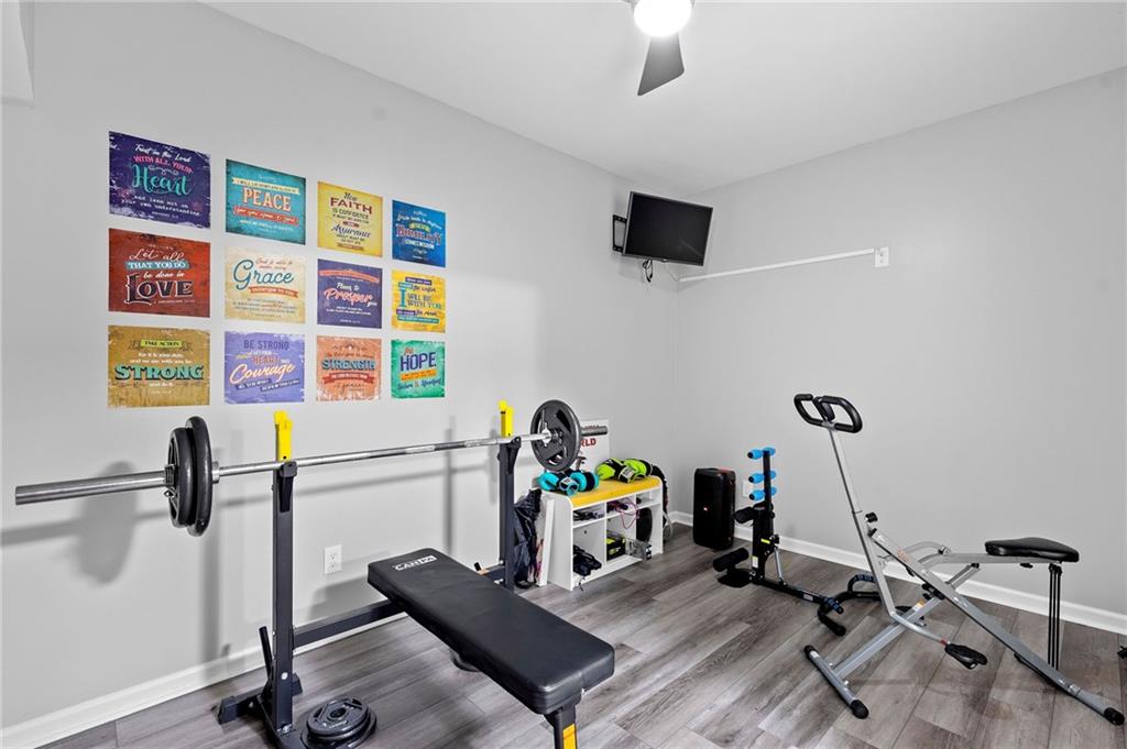 108 Fountain Oak Villa Rica, GA 30180 - Photo 32 of 45 a work room with furniture and a flat screen tv