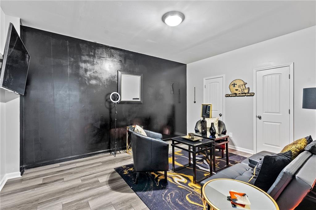 108 Fountain Oak Villa Rica, GA 30180 - Photo 36 of 45 a living room with furniture and a flat screen tv