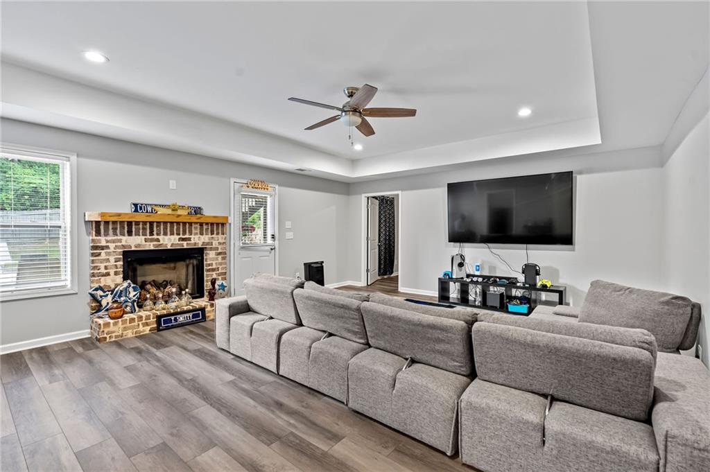 108 Fountain Oak Villa Rica, GA 30180 - Photo 37 of 45 a living room with furniture a fireplace and a flat screen tv