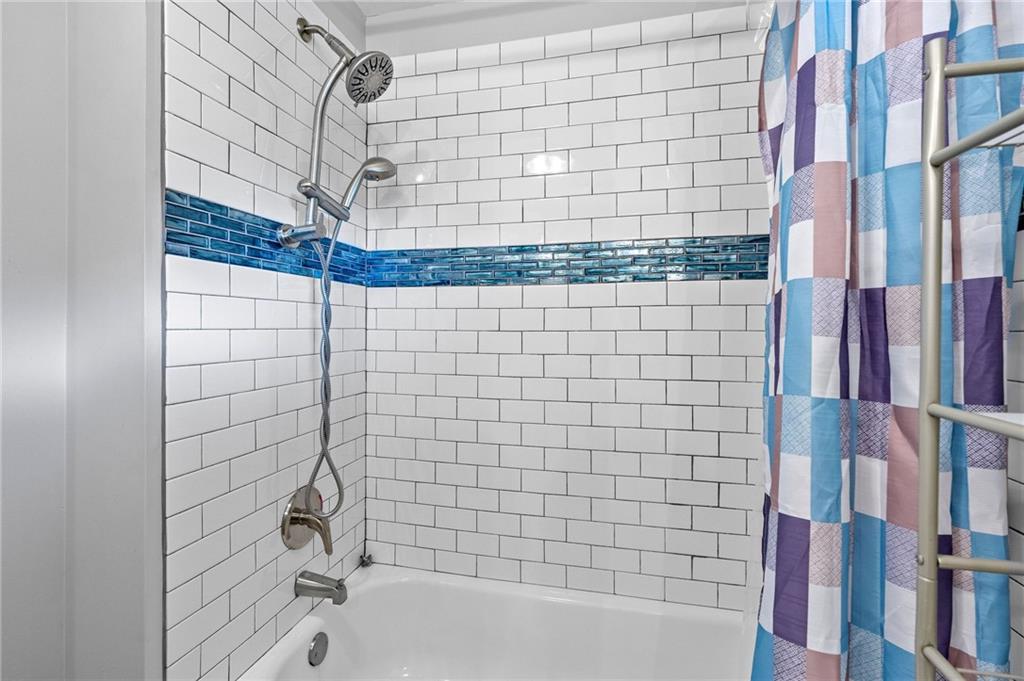 108 Fountain Oak Villa Rica, GA 30180 - Photo 39 of 45 a bathroom with a bathtub and shower