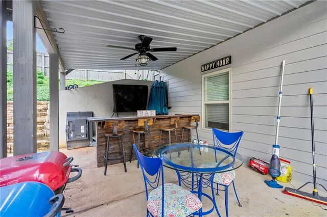 a view of a livingroom with furniture and a flat screen tv
