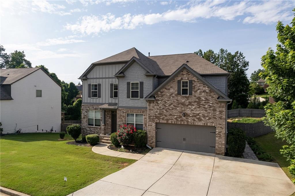 108 Fountain Oak Villa Rica, GA 30180 - Photo 5 of 45 a front view of a house with a garden