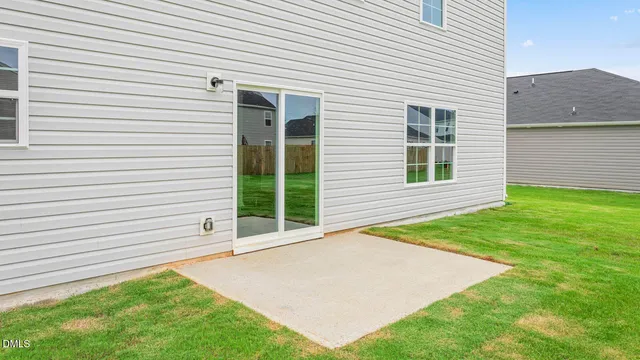 a view of a backyard of the house