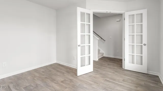 a view of entryway with wooden floor and staircase