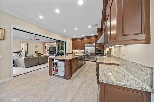a large white kitchen with a large window