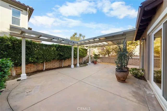 a house with potted plants in front of it