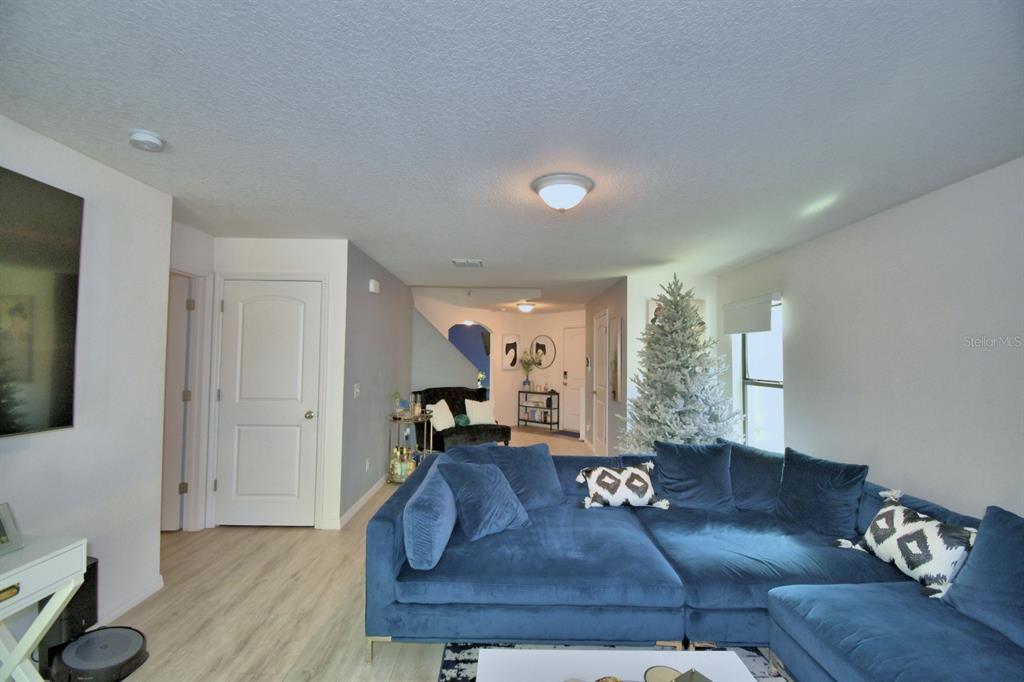 6286 Manitoba Drive Lakeland, FL 33805 - Photo 11 of 28 a living room with furniture and a wooden floor