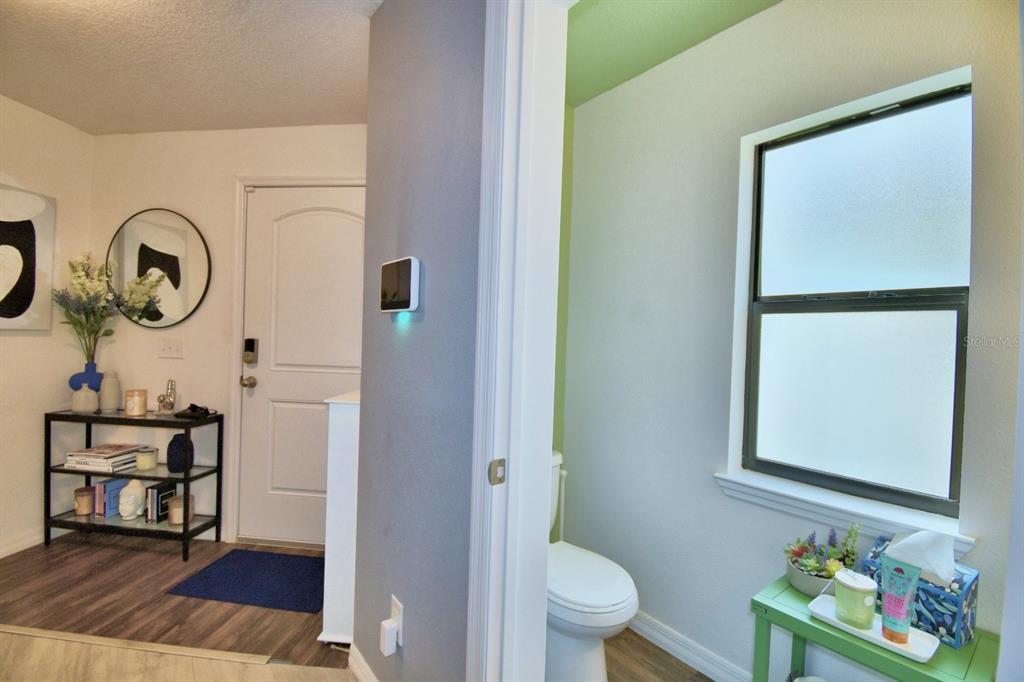 6286 Manitoba Drive Lakeland, FL 33805 - Photo 12 of 28 a bathroom with a toilet and a mirror