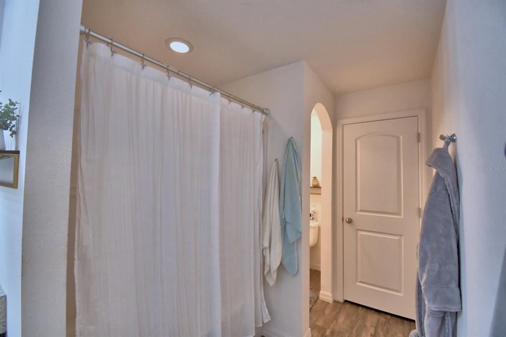 6286 Manitoba Drive Lakeland, FL 33805 - Photo 15 of 28 a view of walk in closet with wooden floor
