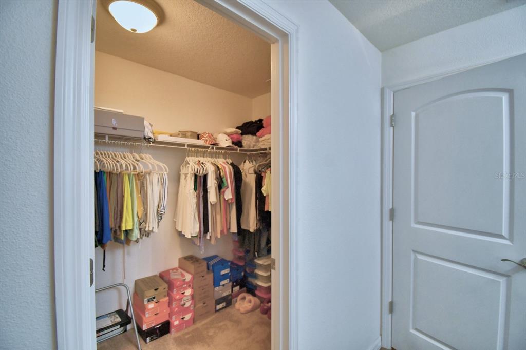 6286 Manitoba Drive Lakeland, FL 33805 - Photo 19 of 28 a view of walk in closet with clothes and shoes