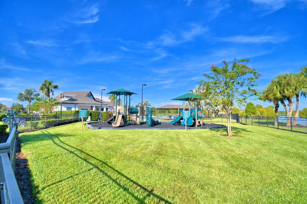 6286 Manitoba Drive Lakeland, FL 33805 - Photo 27 of 28 a view of a house with a yard and sitting area
