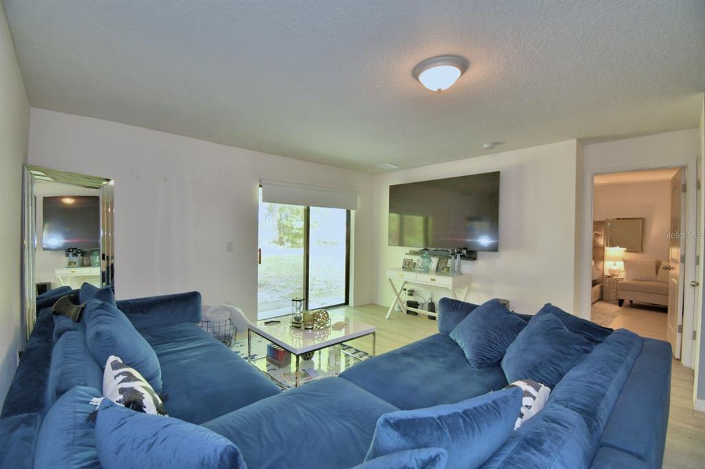 6286 Manitoba Drive Lakeland, FL 33805 - Photo 4 of 28 a living room with furniture and a flat screen tv