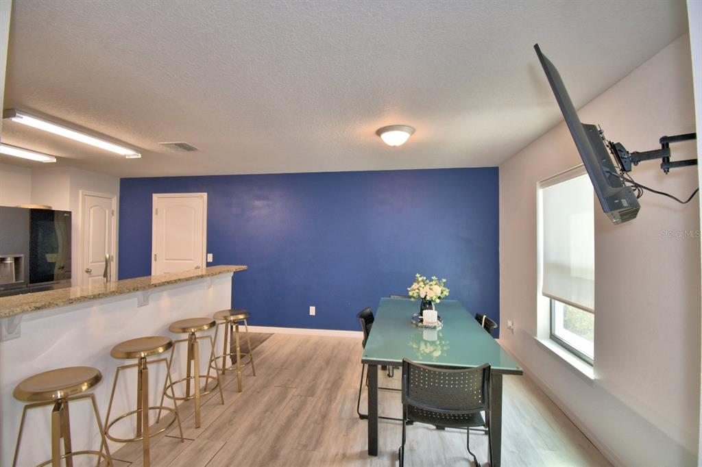 6286 Manitoba Drive Lakeland, FL 33805 - Photo 7 of 28 a workspace with furniture window and wooden floor