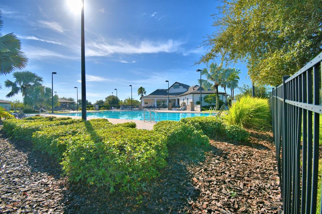 6286 Manitoba Drive Lakeland, FL 33805 - Photo 10 of 28 a view of a garden with a building in the background