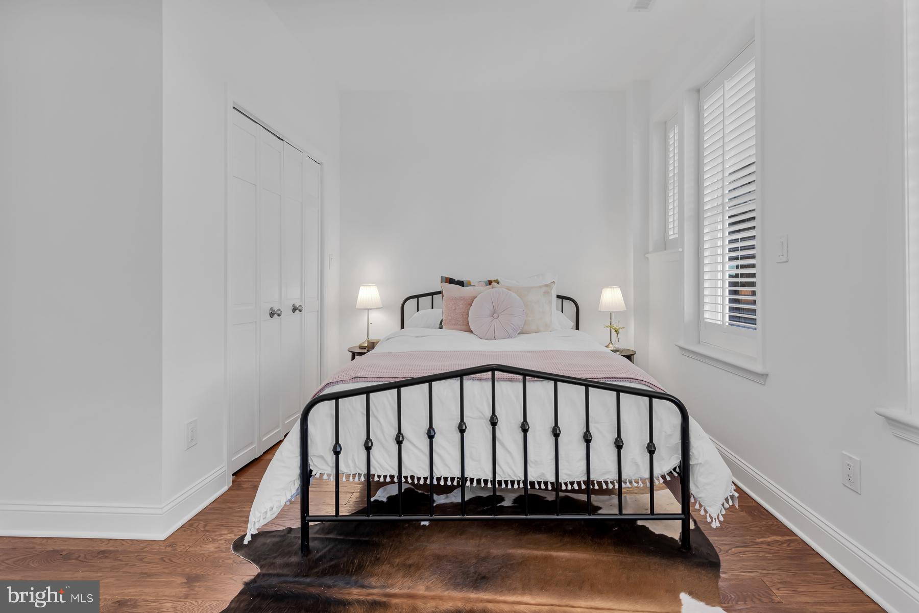 1606 5th Street Northwest, Unit 2 Washington, DC 20001 - Photo 19 of 34 a view of a bedroom with wooden floor