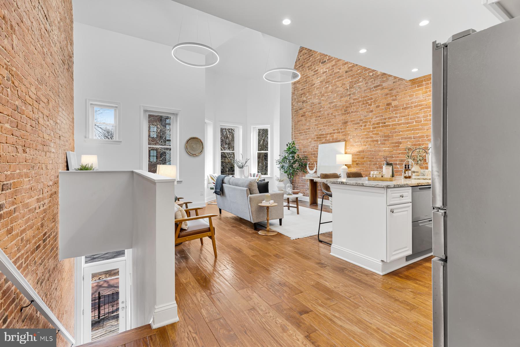 1606 5th Street Northwest, Unit 2 Washington, DC 20001 - Photo 2 of 34 a living room with furniture wooden floor and a large window