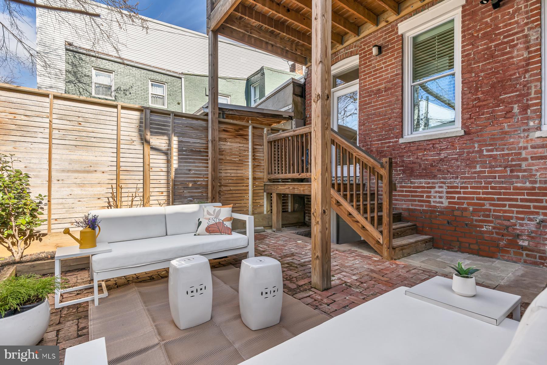 1606 5th Street Northwest, Unit 2 Washington, DC 20001 - Photo 31 of 34 a view of a patio with couches table and chairs and potted plants
