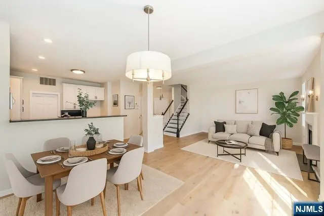 a living room with furniture chandelier and a chandelier