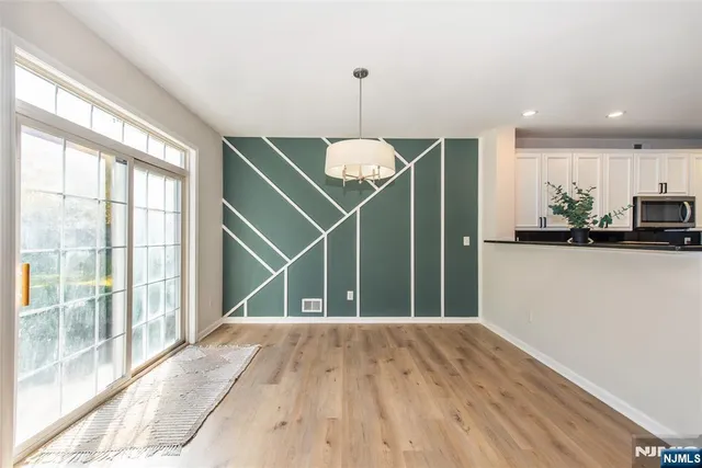 a view of a room with a large window