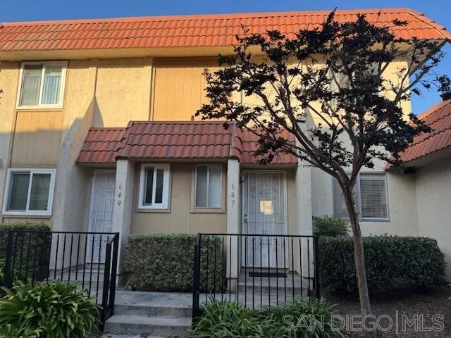 a view of a house with a tree
