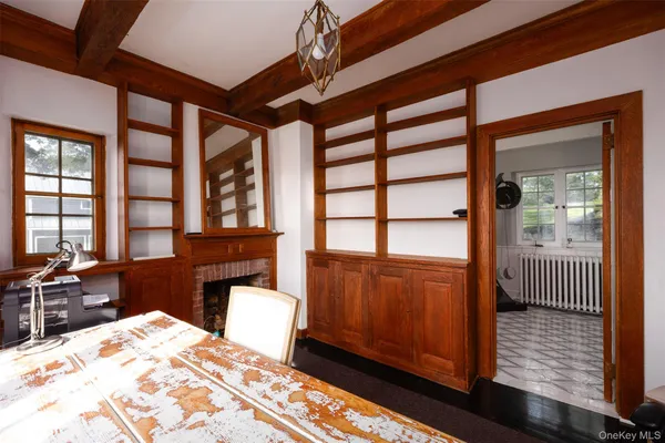 a kitchen with white cabinets and appliances