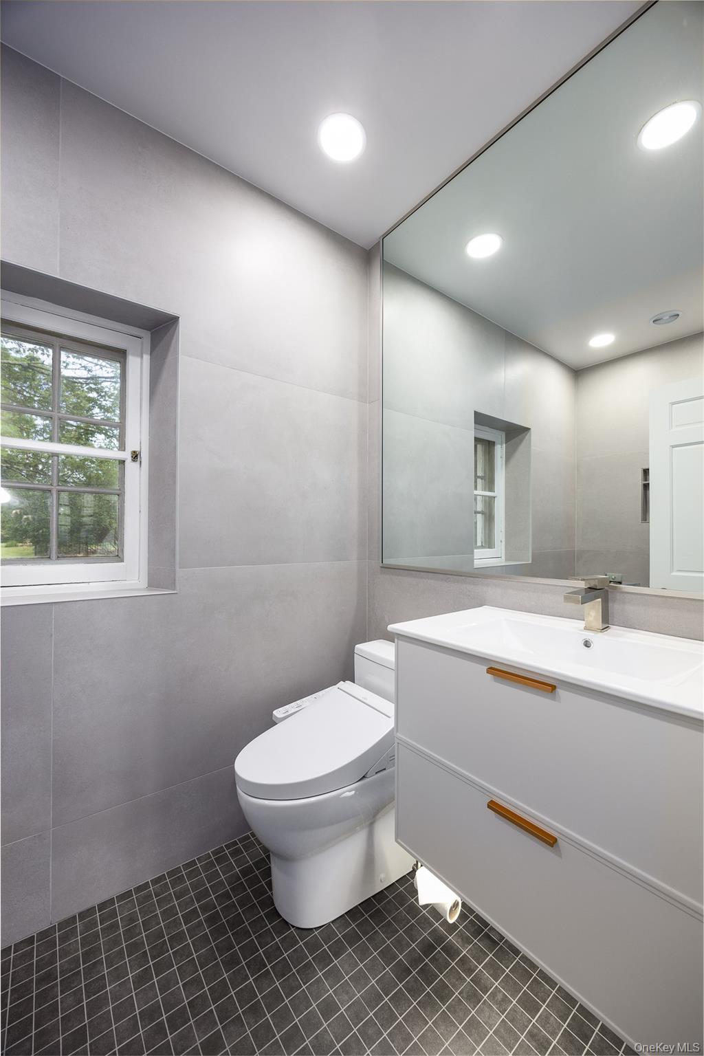 401 Woodmont Road Hopewell Junction, NY 12533 - Photo 18 of 50 a bathroom with a sink toilet and large mirror