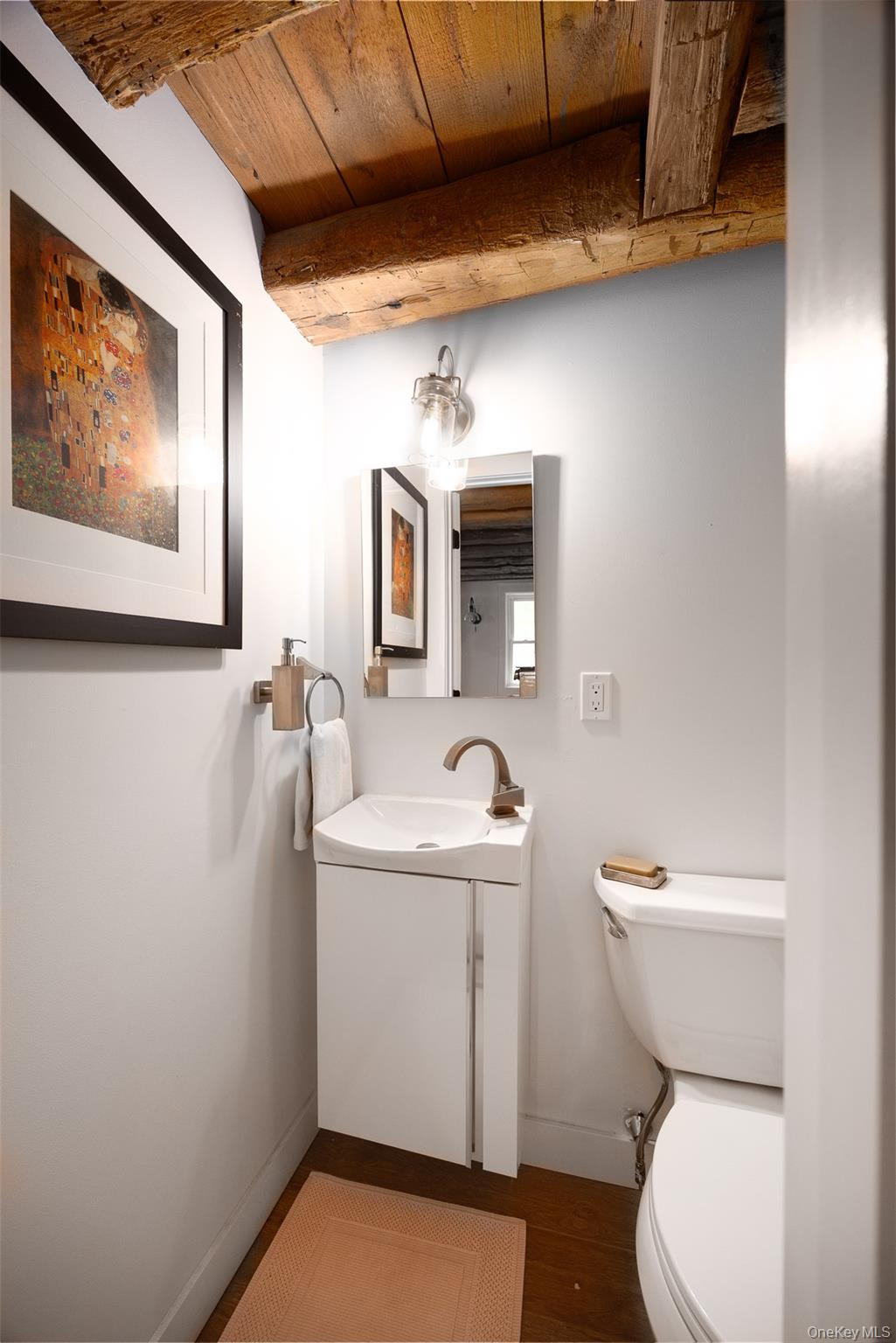 401 Woodmont Road Hopewell Junction, NY 12533 - Photo 41 of 50 a bathroom with a toilet sink and mirror