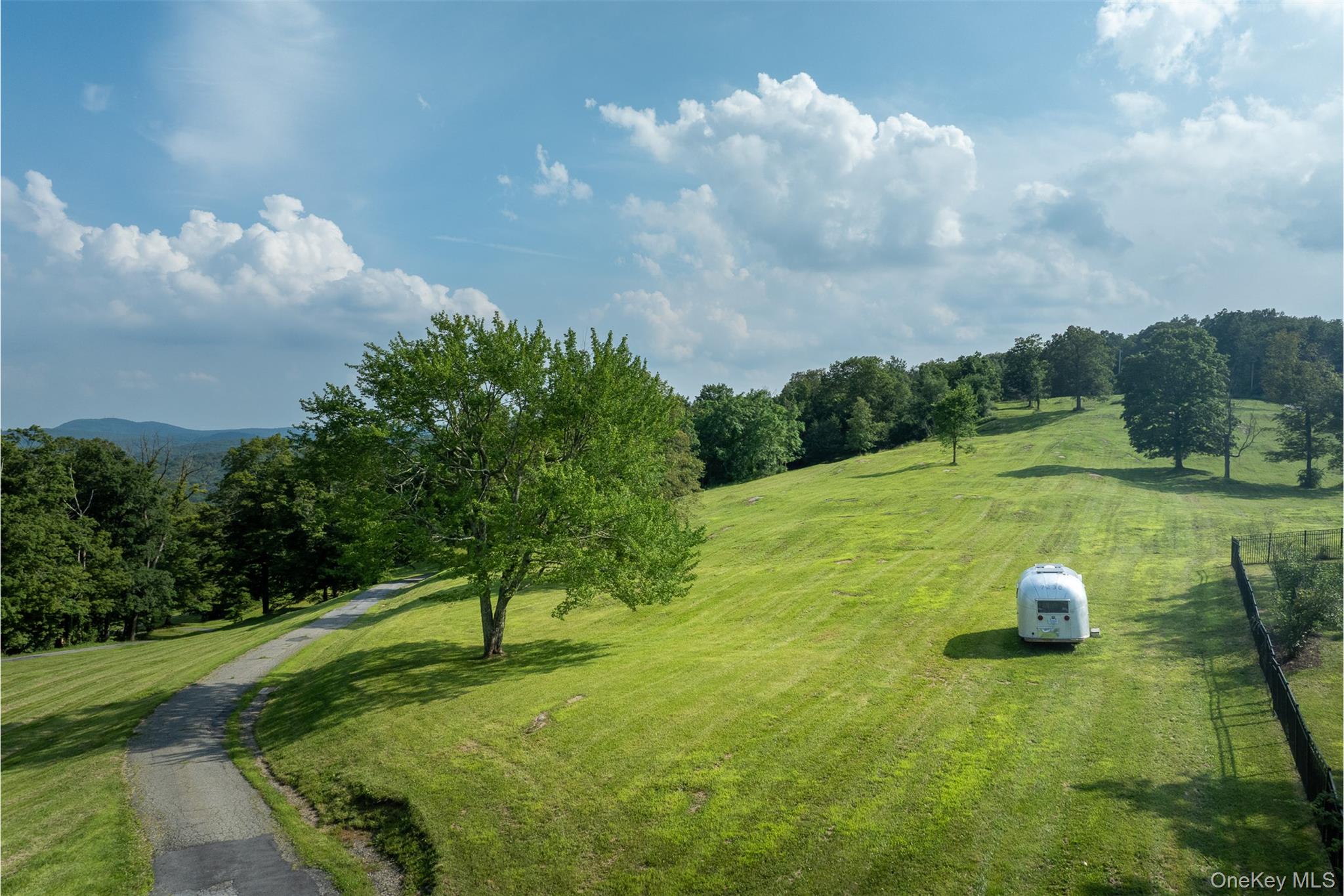 401 Woodmont Road Hopewell Junction, NY 12533 - Photo 48 of 50 a view of a lake with a yard