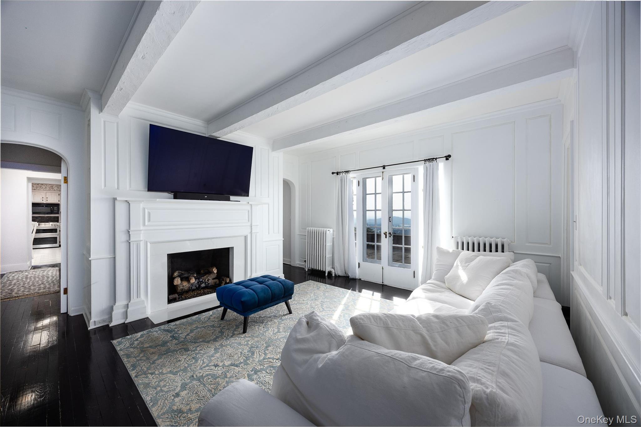 401 Woodmont Road Hopewell Junction, NY 12533 - Photo 10 of 50 a living room with furniture a flat screen tv and a fireplace