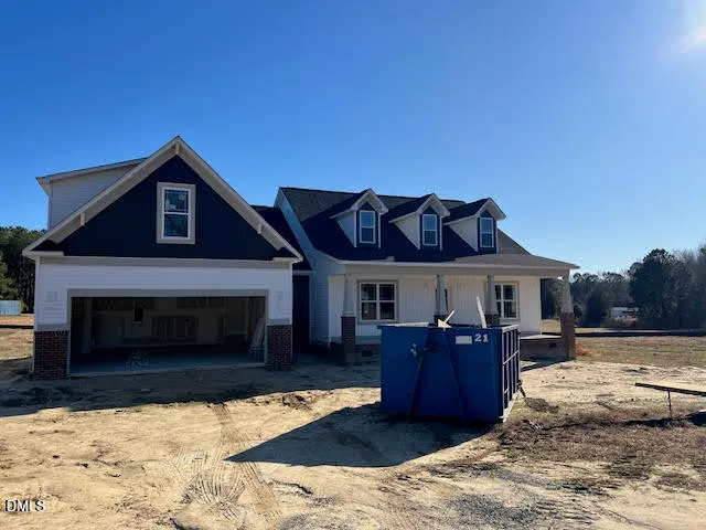 a view of a livingroom with furniture and a fireplace
